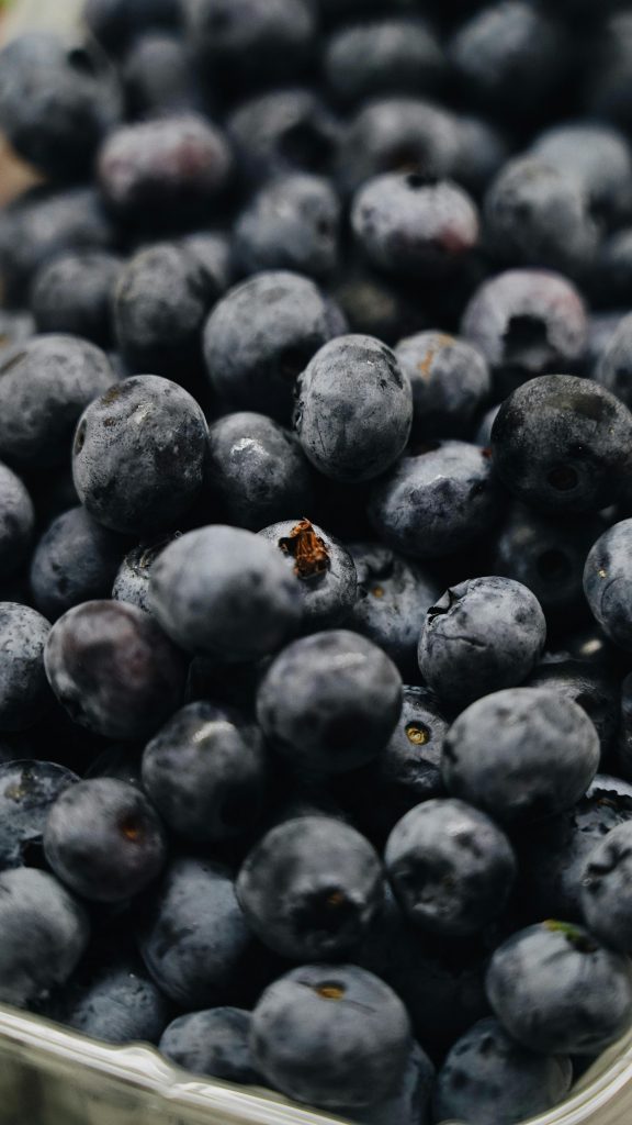 A detailed close-up of ripe blueberries showcasing their vibrant color and texture.